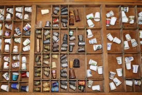 A collection of thimbles and thimble display units, books etc